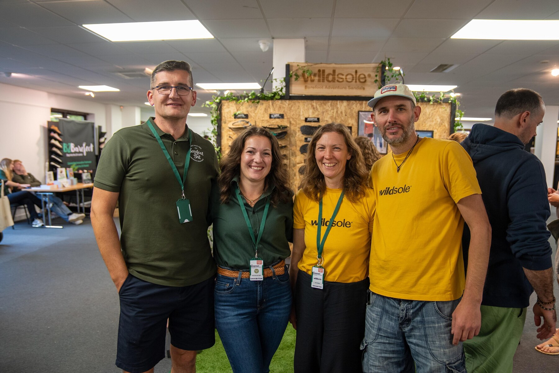 The Wildsole team posing beside their sandal display, photo by Barefoot Brit Expo